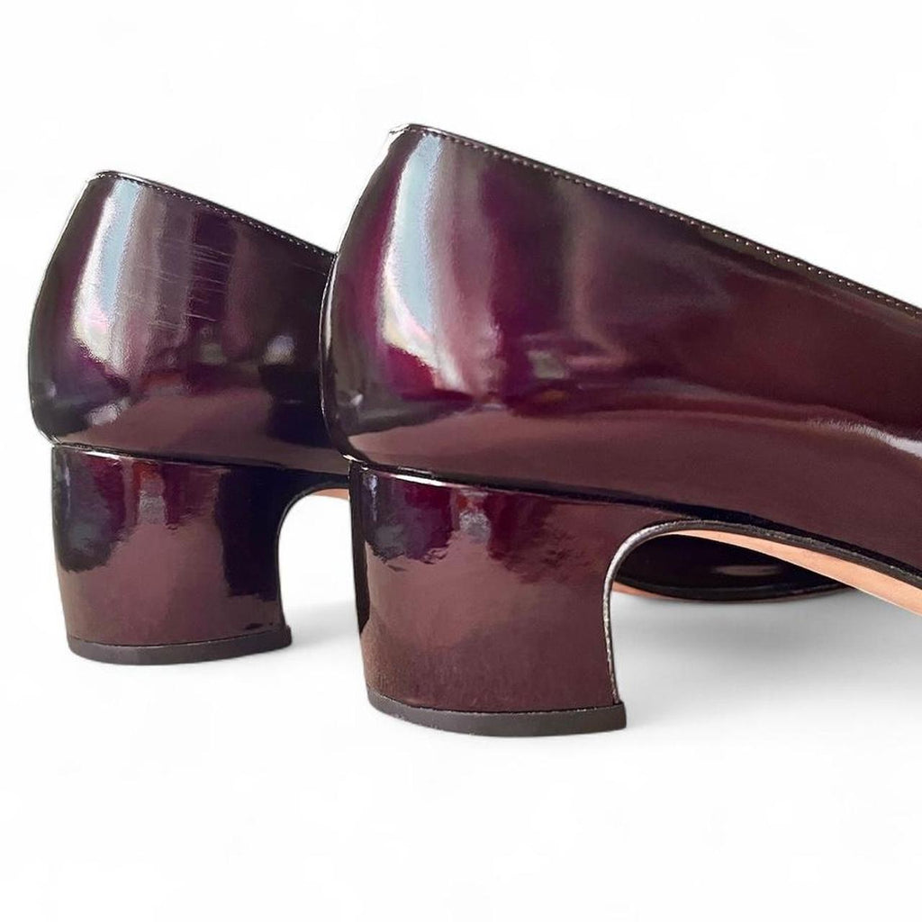 Burgundy patent leather pumps with logo buckle (US 8.5)