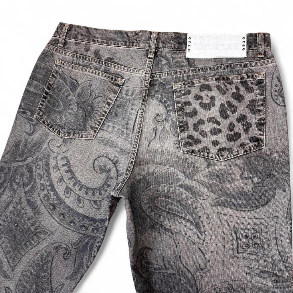 Gray paisley patterned jeans with leopard print pocket on a white background