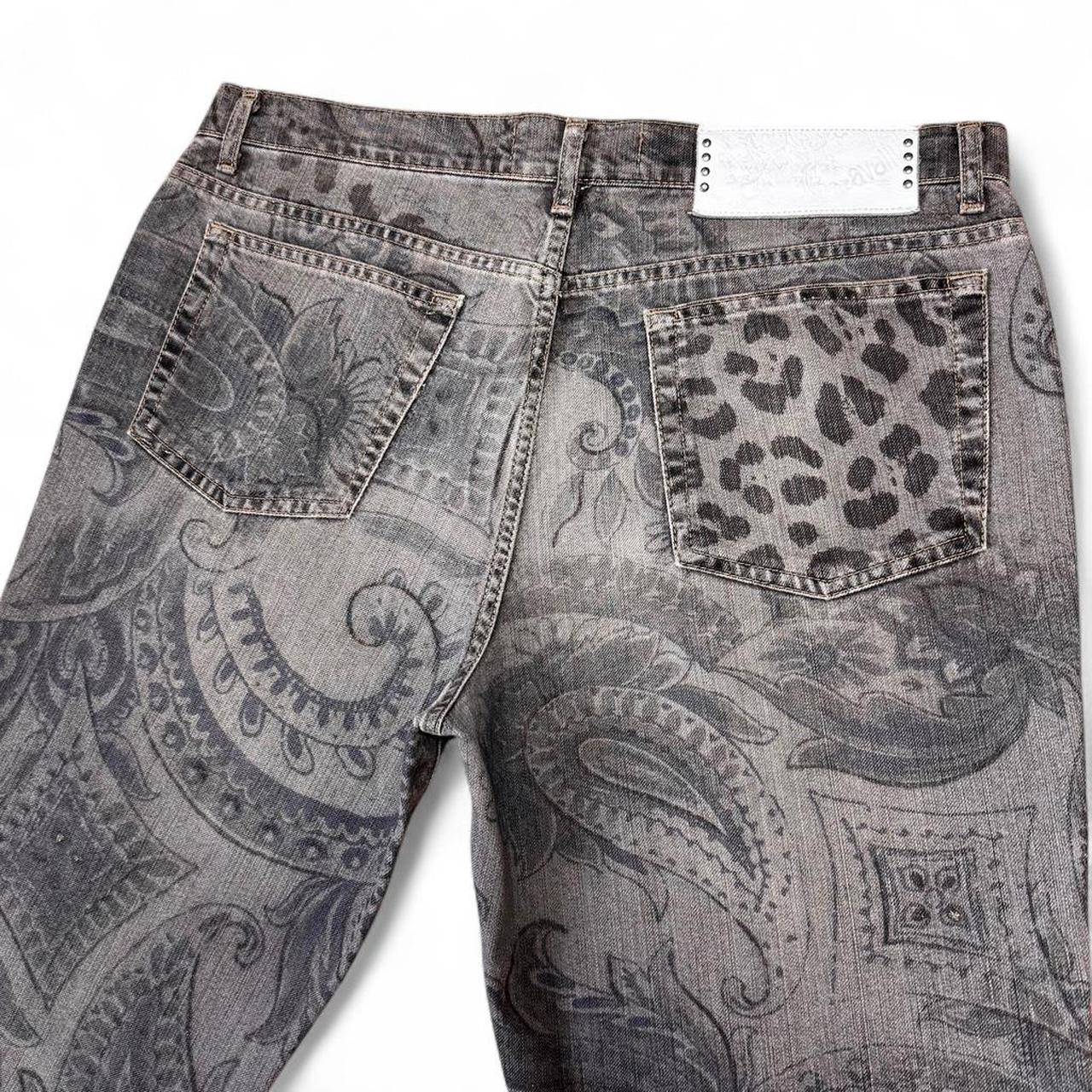Gray paisley patterned jeans with leopard print pocket on a white background