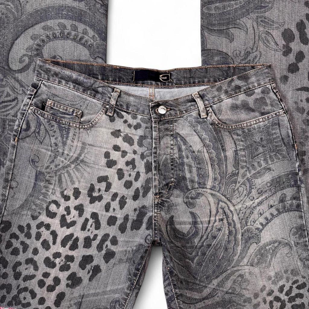 Gray jeans with leopard print and paisley pattern on a textured background