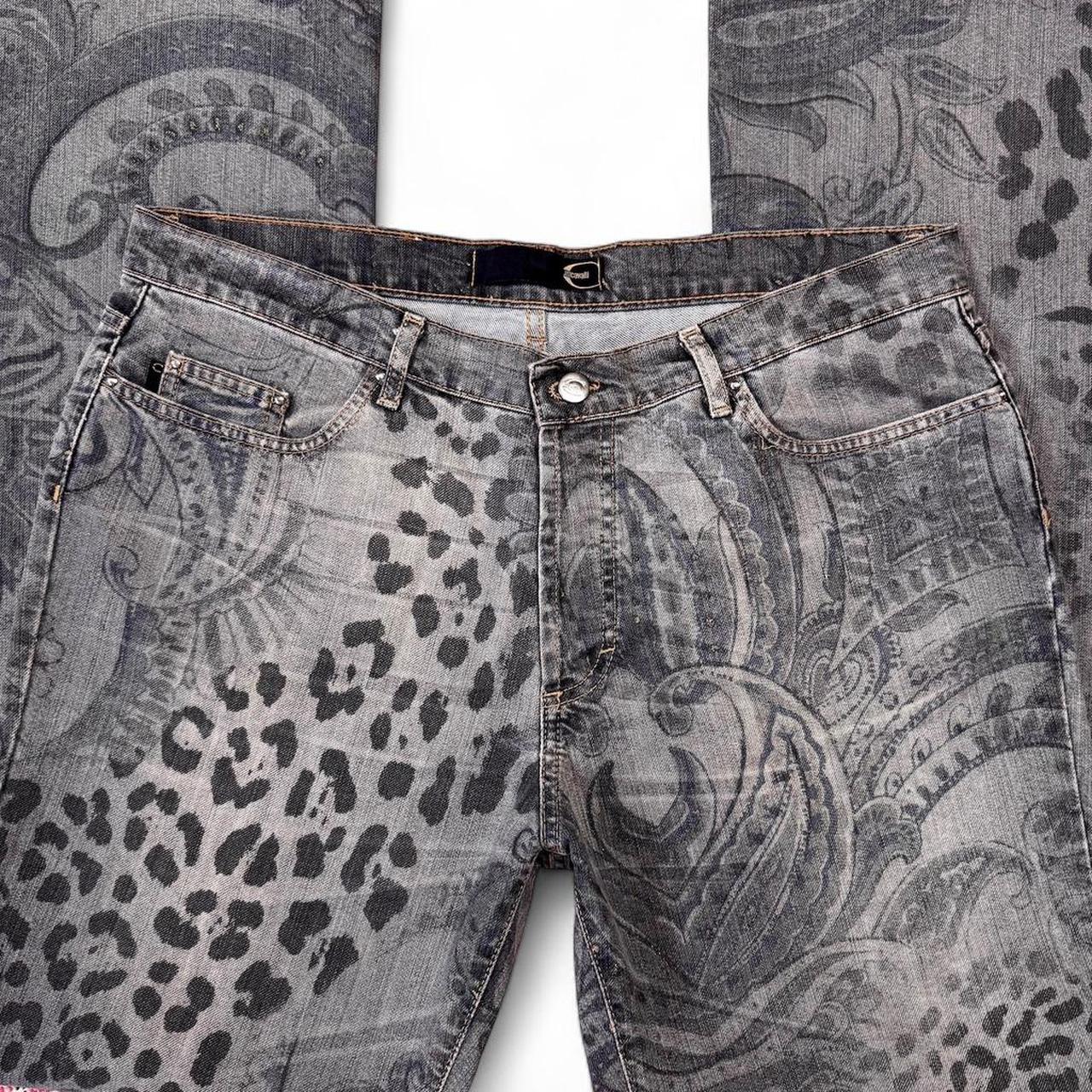 Gray jeans with leopard print and paisley pattern on a textured background