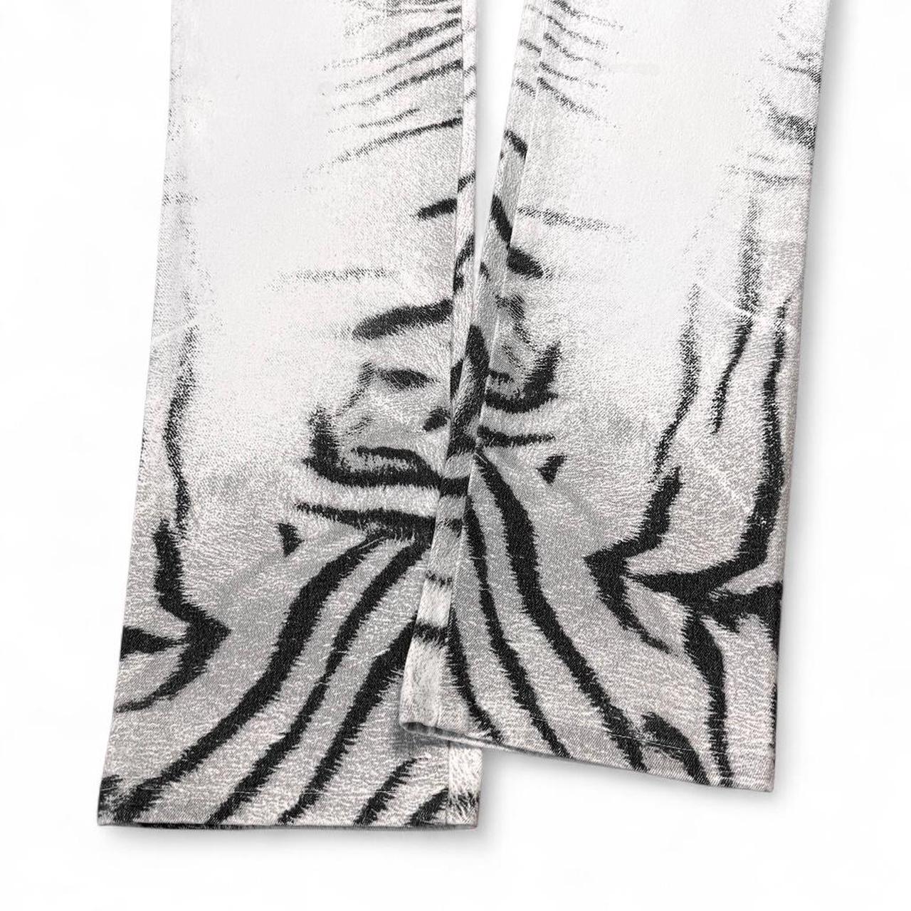 Two zebra-striped towels on a white background